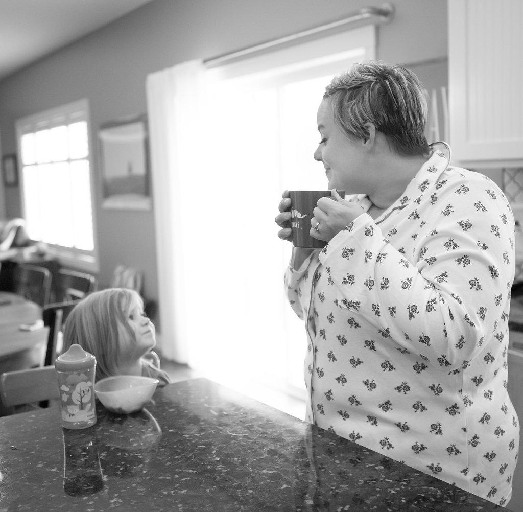 daughter looking up at her mother