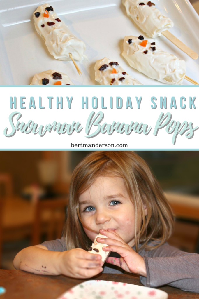 Girl eating healthy holiday snack Healthy-holiday-snack-for-kids-Snowman-Banana-Pops
